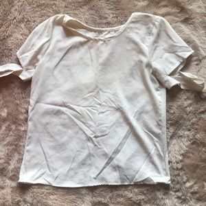 Cream top with criss cross back